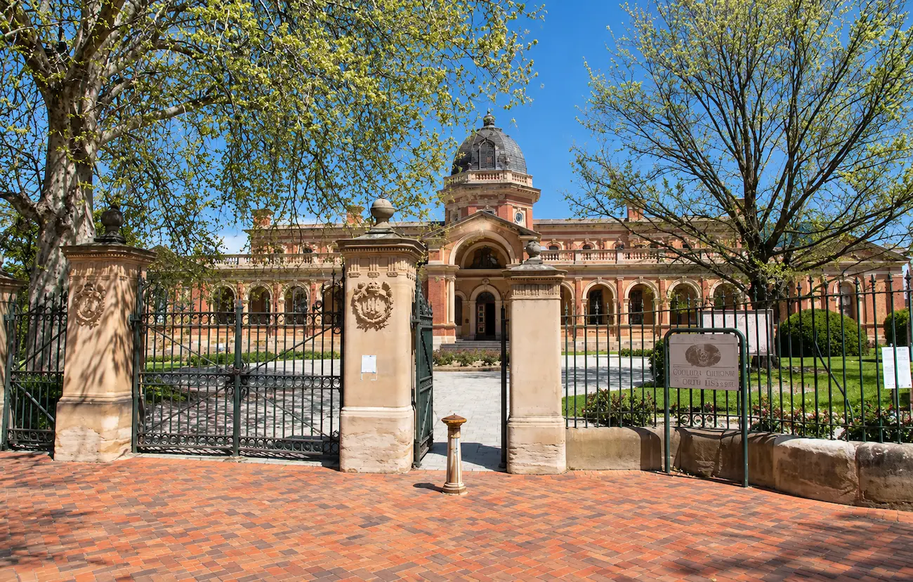 Goulburn Local and District Court on Montague Street, seen through its ornate iron gates