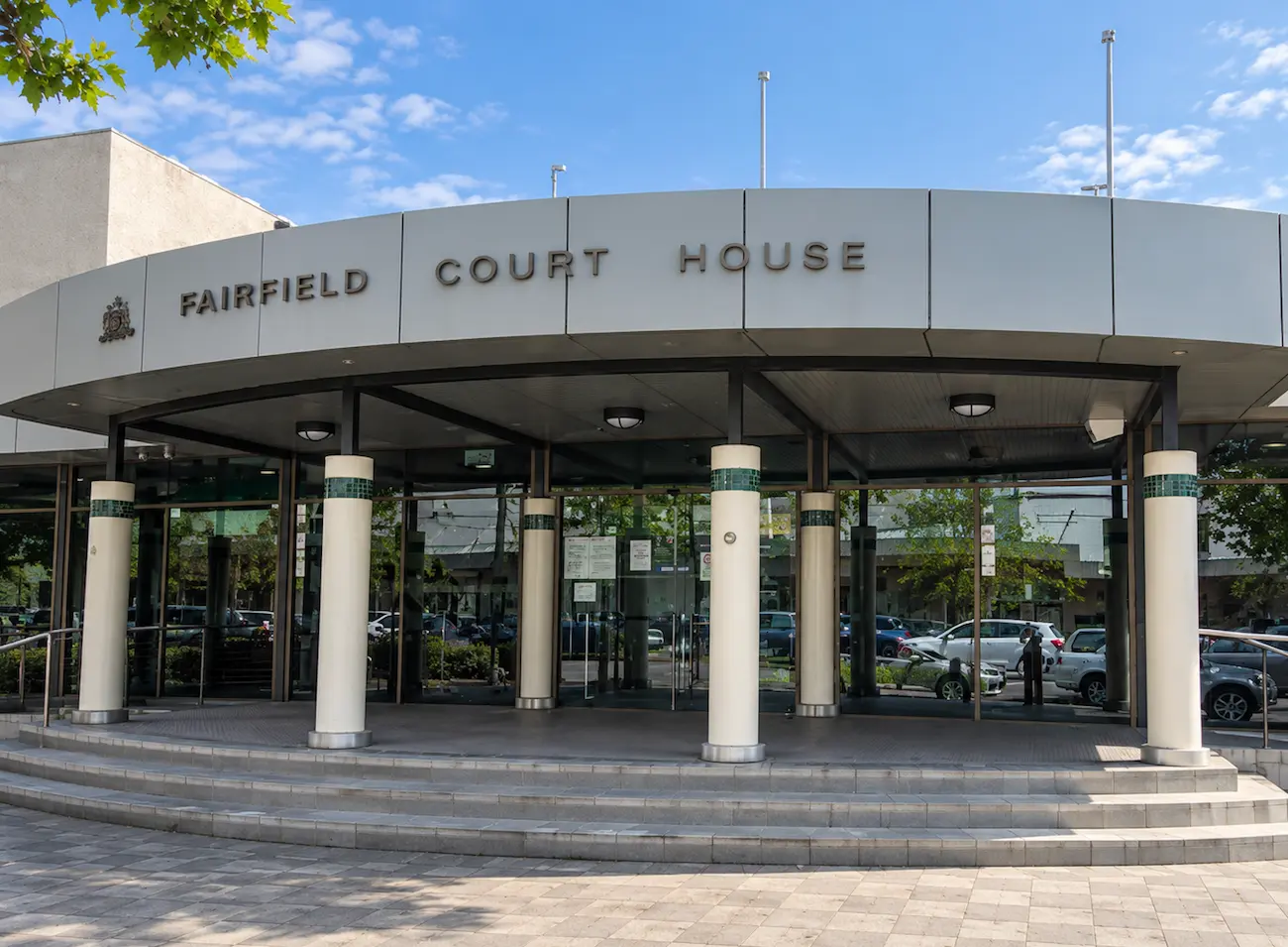 Curved entrance of Fairfield Court House with white columns and front steps, Fairfield