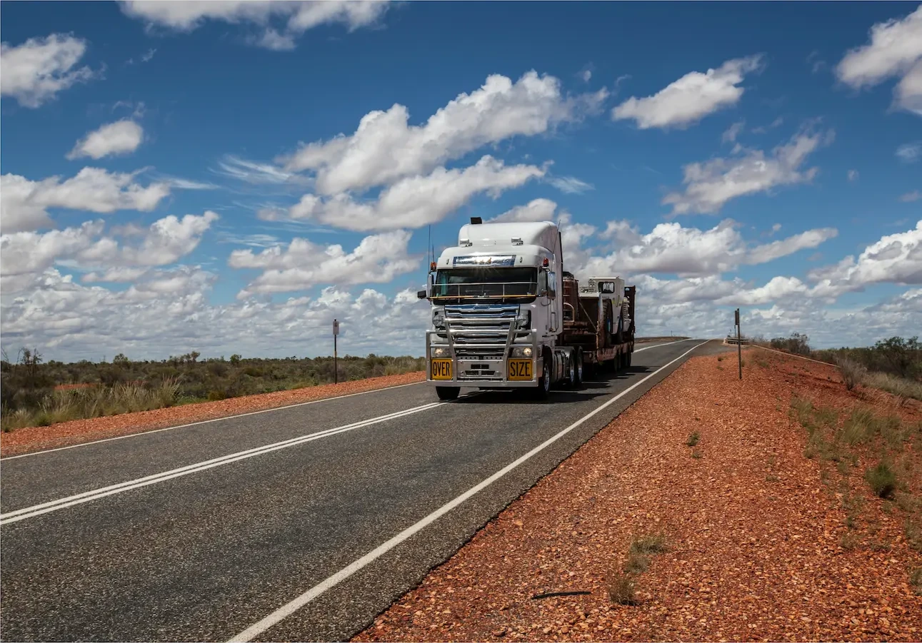 Heavy vehicle on a long-distance outback highway, where work diary entries must be accurate